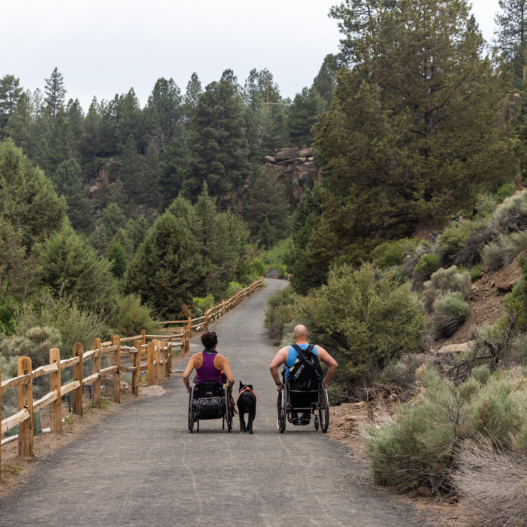 Wheelchair users on the Deschutes River Trail in Bend, OR
